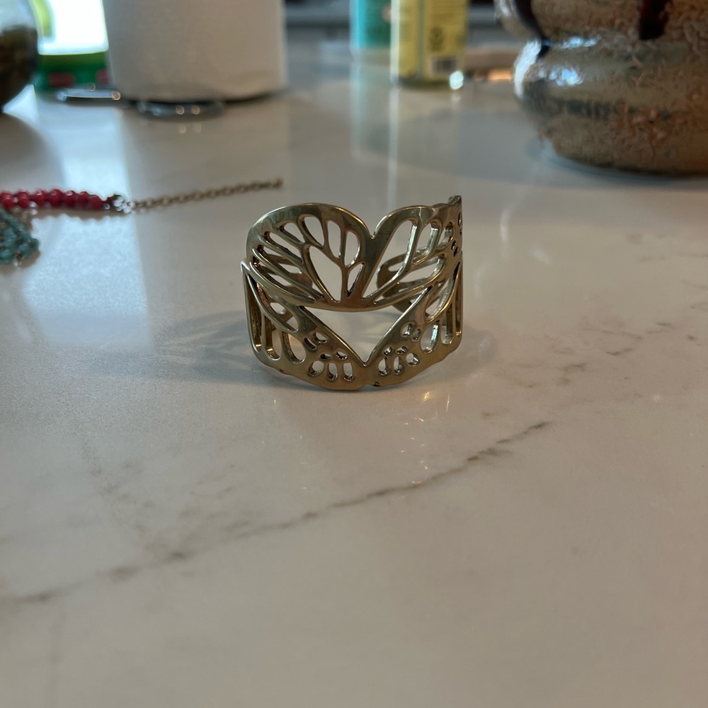 Gold tone butterfly wing cuff
